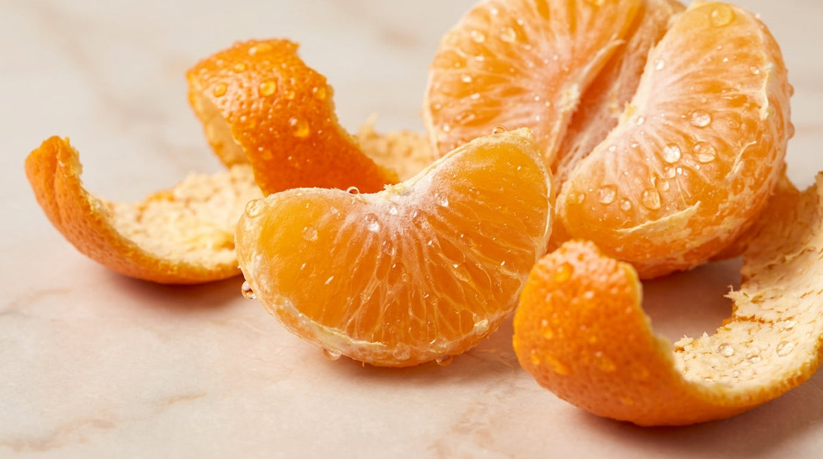 Fresh Sargodha Kinnow fruit with natural water drops showcasing skin health benefits